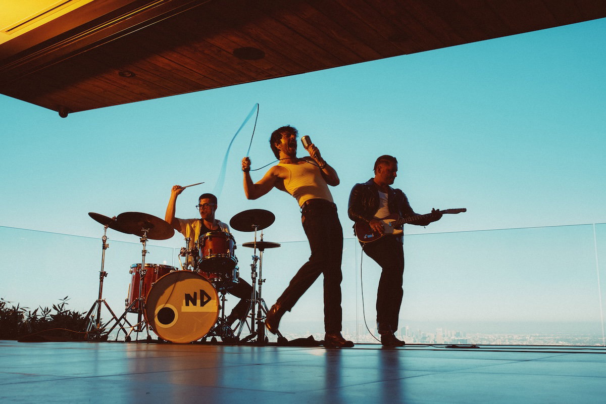Nicotine Dolls sky performance press image by Travis Shinn