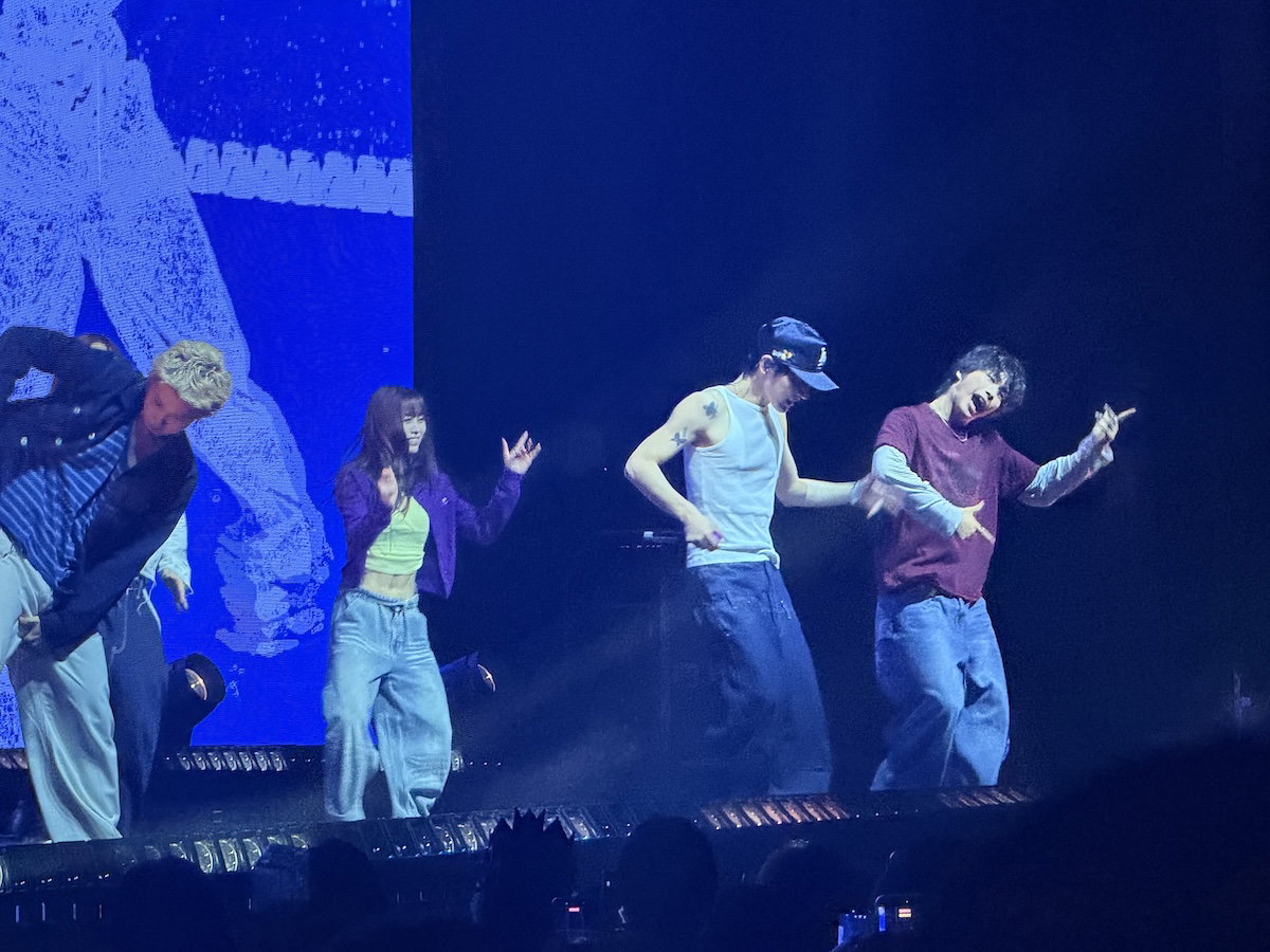TEN performing choreography at The Novo with group onstage
